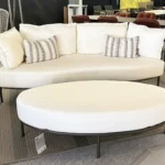 Fischer Möbel Sofa und Hocker Aura in unserer Ausstellung